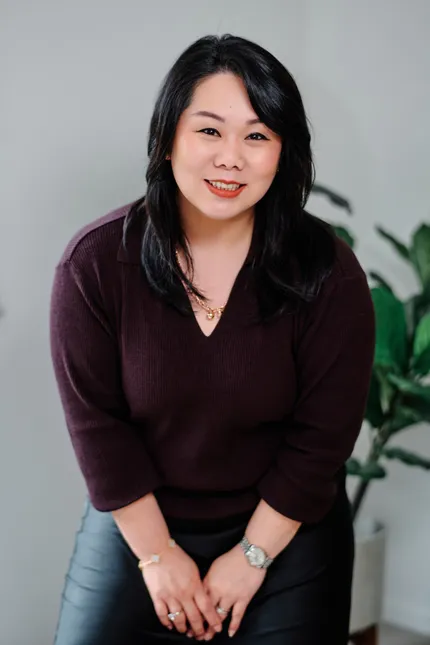 Jenny Budiman, founder of Circle Finance, smiling in her Melbourne office